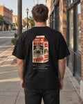 Not Lost. Found. Milk Carton tee on a small-town sidewalk, back view