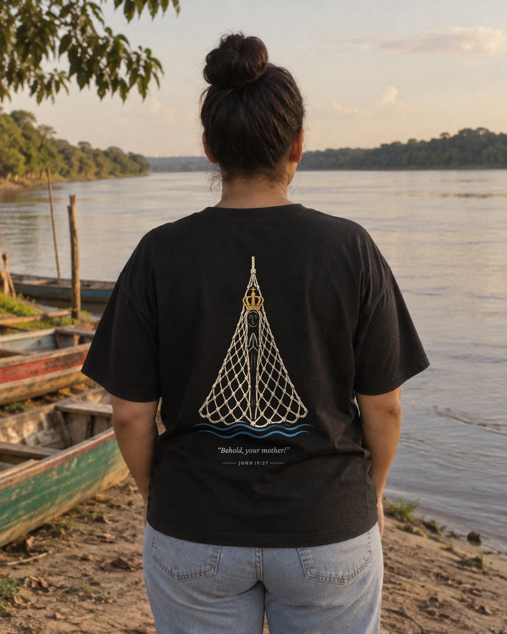 Aparecida in the Net tee on a riverbank, back view