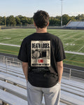 Undefeated Sports Page tee in stadium bleachers, back view