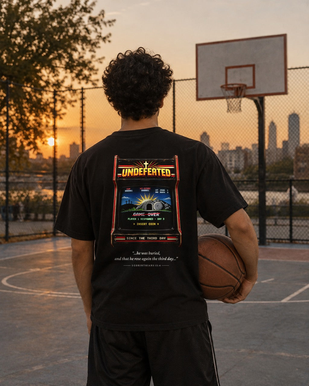 Undefeated Arcade tee on a basketball court, back view