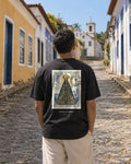 Aparecida 1717 Stamp tee on a colonial street, back view