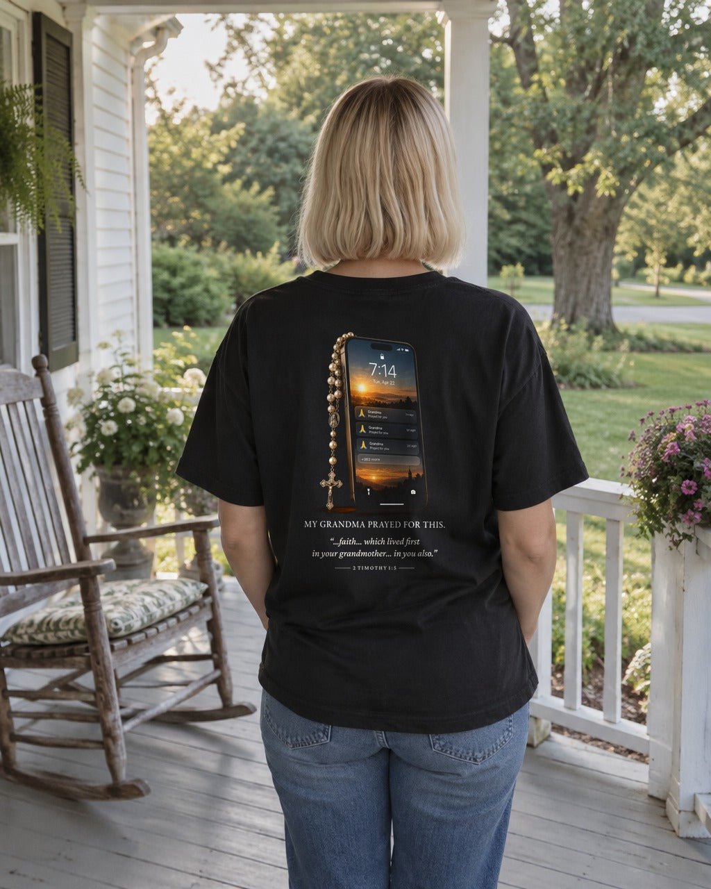 My Grandma Prayed for This Phone tee on a porch, back view